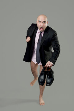 Bald businessman getting late for work 