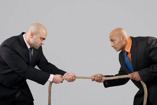 Tug of war between two businessmen 