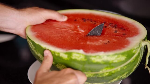 Slicing Ripe Watermelon Half With Sharp Knife On Plate. Summer Refreshing Organic Fruit 