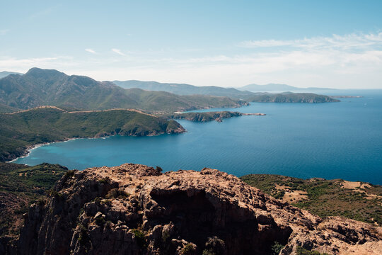Wild rocky coastline and crystal-clear turquoise waters in Corsica