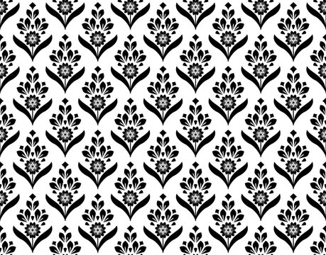 Floral pattern. Seamless vector background. Vintage wallpaper in the Baroque style. White and black ornament for fabric, wallpaper, packaging. Ornate Damask flower illustration.