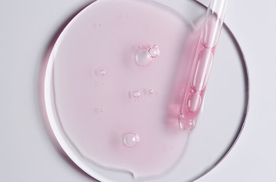 Pink cosmetic product for skin care. A serum or body gel or a moisturizer.