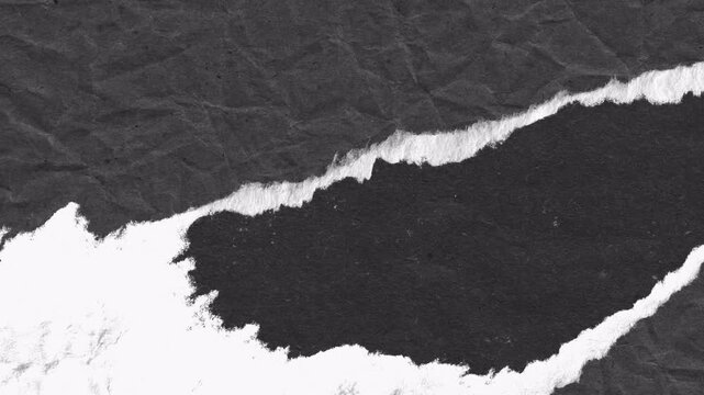 Abstract dark paper texture with a diagonal torn edge effect reveal.