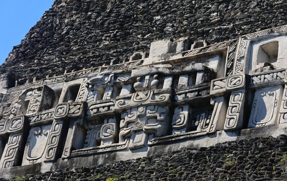 Macro cutout of the Xuantunich Maya Ruin frieze with blue sky, Belize
