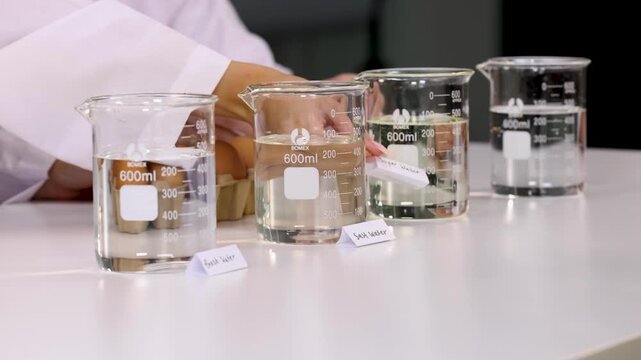Teenager Conducting Science Experiment with Eggs and Beakers in Laboratory