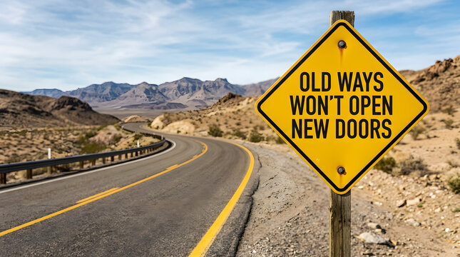 Yellow road sign warns about old habits on winding desert highway
