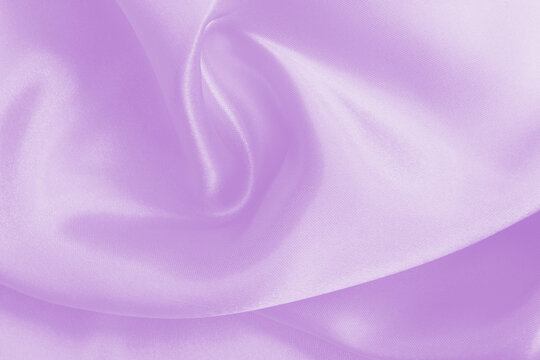 Light purple fabric texture background, detail of silk or linen pattern.