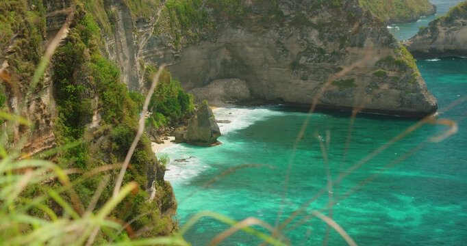 High angle view of turquoise pcean waves and white sand at Diamond Beach cliffs in Nusa Penida Island Bali