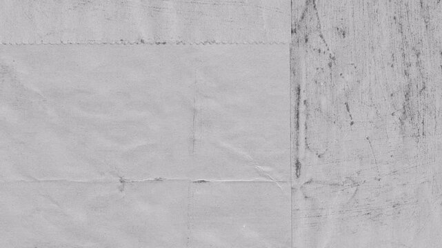 Abstract grey concrete wall texture with light scratches and surface imperfections.