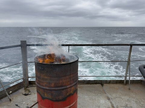 fire in barrel on board the ship.