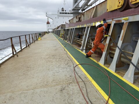 deck works on board the commercial ship.