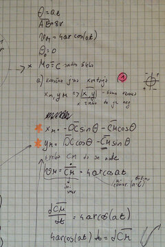 Handwritten kinematics equations angular motion notebook