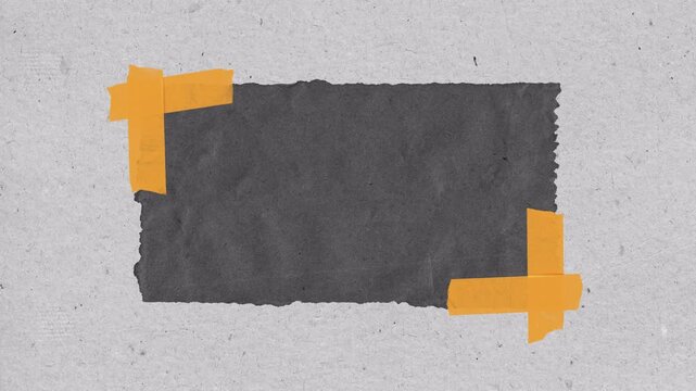 Black paper note attached with orange tape on textured gray background.