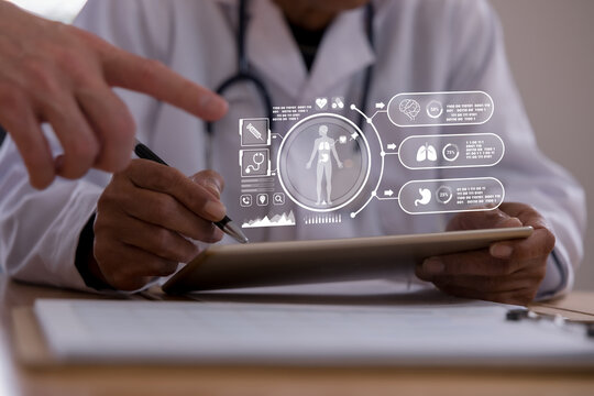 Doctor using a tablet with digital healthcare interface showing human body and organ data, representing medical technology, patient monitoring, diagnosis, telemedicine smart hospital innovation.