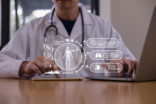 Doctor using a tablet with digital healthcare interface showing human body and organ data, representing medical technology, patient monitoring, diagnosis, telemedicine smart hospital innovation.