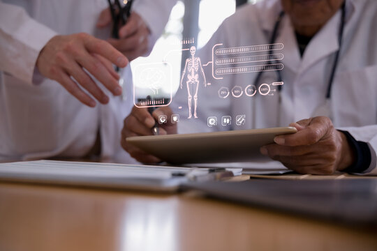 Doctor using a tablet with digital healthcare interface showing human body and organ data, representing medical technology, patient monitoring, diagnosis, telemedicine smart hospital innovation.
