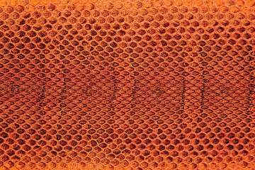 Fototapeta premium Red python snake skin as abstract background, exotic animals. Natural snake skin pattern.