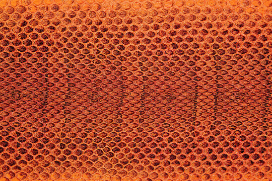 Red python snake skin as abstract background, exotic animals. Natural snake skin pattern.