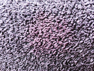 Close-up texture background of dark purple towel fabric material with soft fibers © Kristiningrum