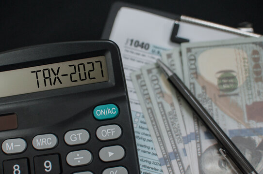 Business concept financial planning for future tax season in 2027 digital calculator displaying tax deadline.