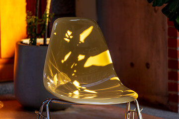 Fototapeta premium Modern Transparent Chairs in Warm Sunlight