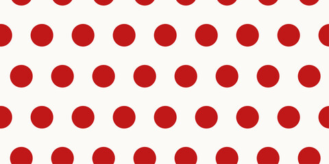 Fototapeta premium Festive Christmas red polka dot seamless pattern on simple white background