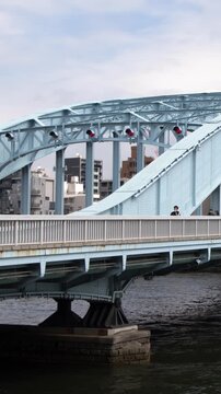 Blue Steel Arch of Eitai Bridge Over Sumida River in Tokyo