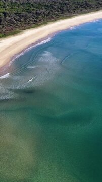 Aerial View of Turquoise Ocean Waves and Sandy Beach
