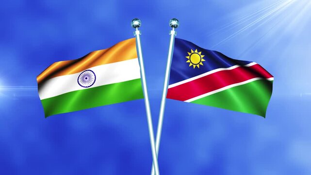 India and Namibia Flag Relations Concept with Crossed National Flags Waving on Pole Loop Against a Bright Cloudy Sky