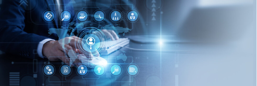 HR manager analyzing employee performance data Using Computer optimizing Human Resources frameworks across the Global network corporate branches. Strategic workforce management solutions.