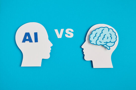 AI vs human brain concept with VS text between silhouettes