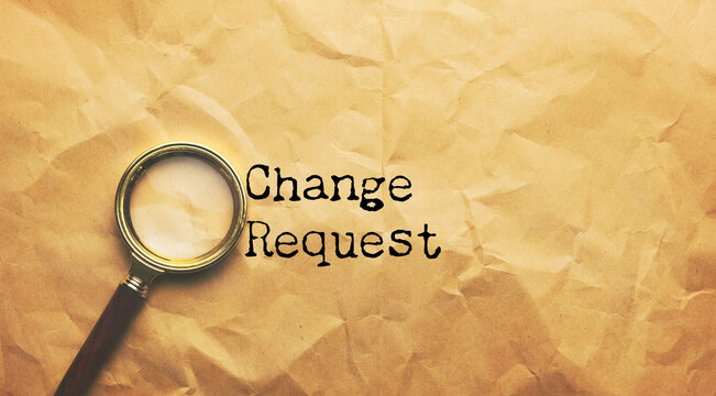 Change request message written on lined card with pen