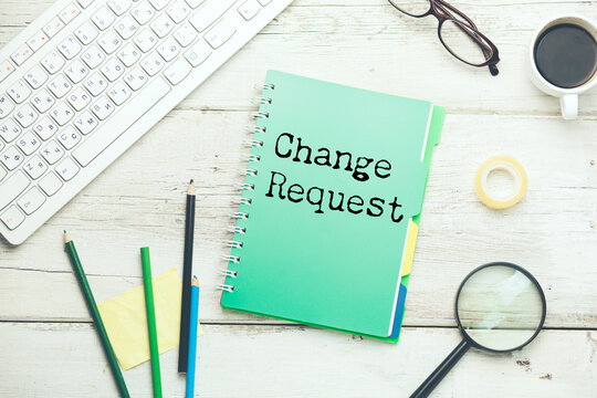 Change request message written on lined card with pen