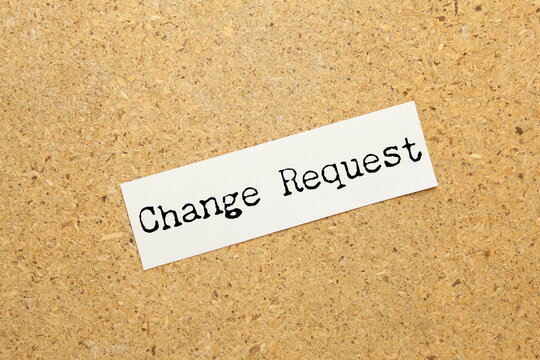 Change request message written on lined card with pen