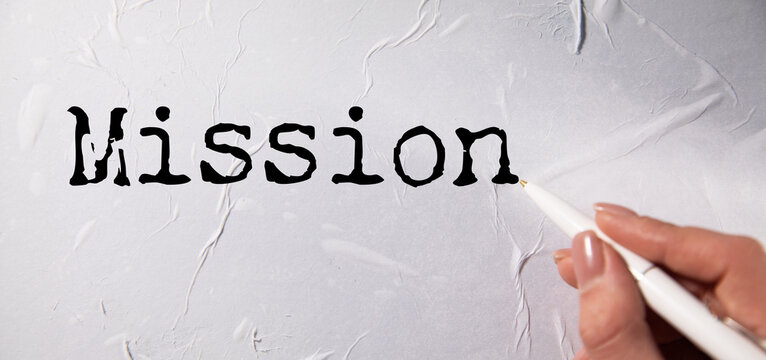 Torn paper with word Mission