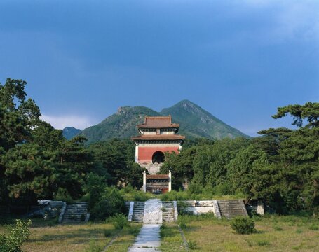Ancient Ming Dynasty mausoleum, Chinese imperial tomb surrounded by green mountains and forest