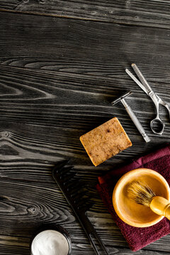 Tools for cutting beard barbershop top view on wooden background