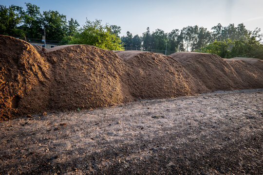 Large Sand Piles Delivered for Road Construction and Repair