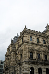 Corner of a historic stone palace with balustrades and pinnacles © Ekaterina