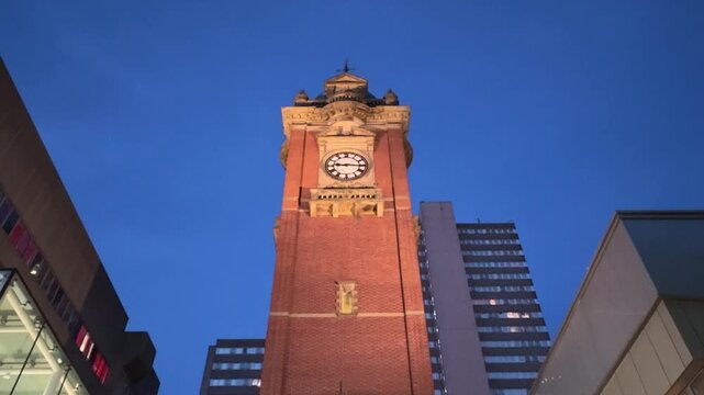 View of the Victoria Centre Clock Tower on Milton Street in Nottingham city centre, featuring a well-known urban landmark and shopping district setting.