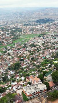 Cinematic aerial view of Antananarivo city with Rova of Antananarivo palace complex in Madagascar.
