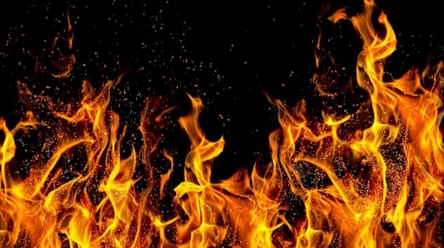 Burning fire flame background with glowing spark pattern and hot thermal texture for fiery design and digital art
