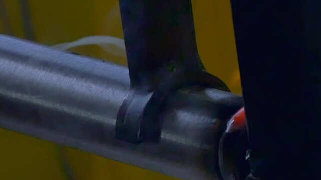 Close-up views showcase an advanced argon welding robot skillfully fusing metal pipes. You can see bright sparks and glowing welds as it performs precise and efficient welding work.