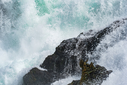 waves crashing on rocks