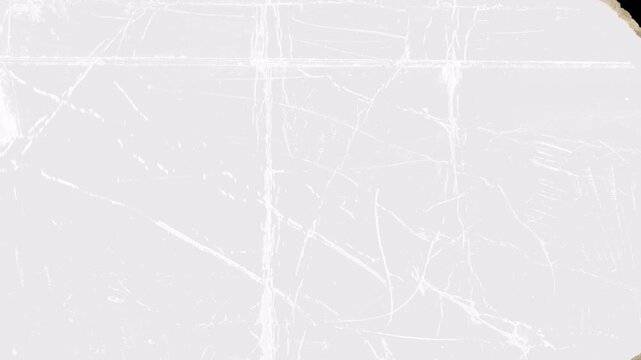 Abstract white paper texture with torn edges and scratches on black background.