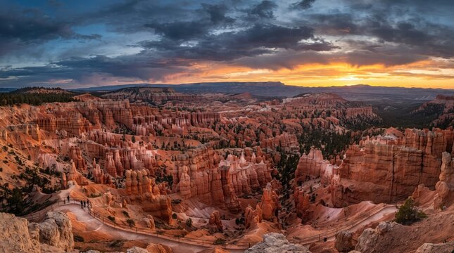 Panoramic view of bryce canyon national park at sunrise with dramatic clouds over the red rock hoodoos