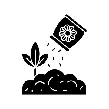 Applying fertilizer to plant icon, soil nutrient and crop care vector silhouette