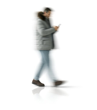 Motion blur walking man silhouette holding smartphone isolated on transparent background for mockup scene