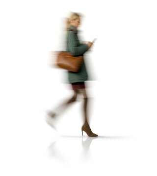 Motion blur walking woman silhouette with smartphone isolated on transparent background for mockup scene
