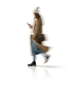 Motion blur walking woman silhouette holding smartphone isolated on transparent background for mockup scene